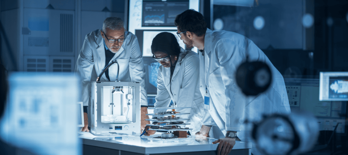 Three male sientists researching in a lab